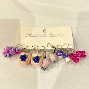 Never worn five piece purple earring set